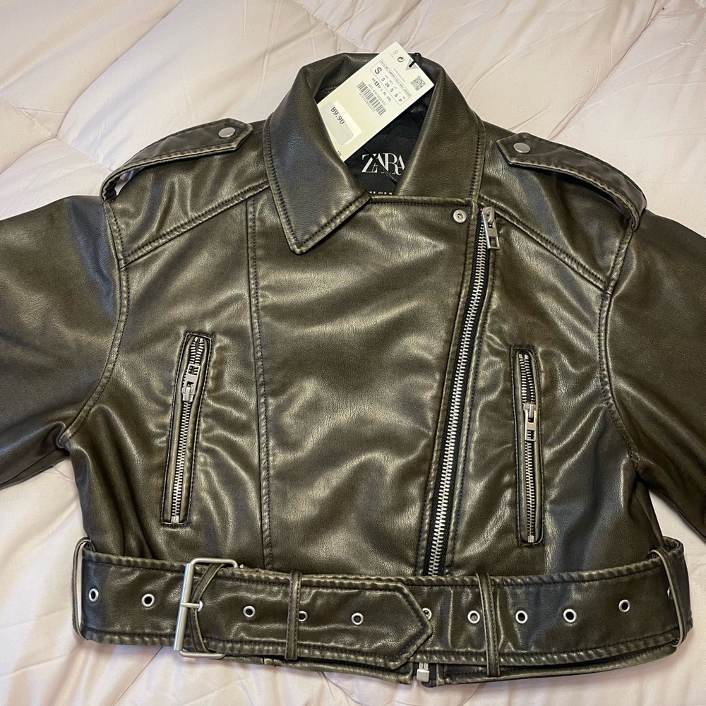 BRAND NEW faux leather jacket with buckle